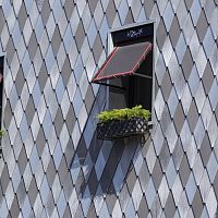 Zinc-titanium roof tile elZinc®interlockingbullnoselozenge-patterned