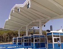 Metal frame tensile structure AUTOROUTE SMIRcanopyroofwith PVC membrane