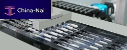 Syringe feeder roboticpackaging machine
