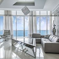 Design table FRAMEglasspolished stainless steel basetriangular